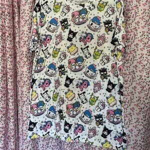 Sanrio All-Over Character Tee — White with Pink, Blue, Yellow, Black Accents
